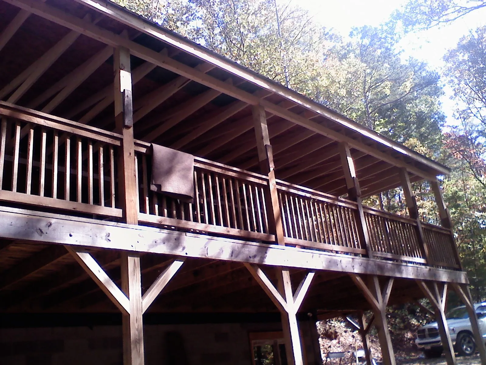 Timber framing under a new elevated porch and deck — Roof Leak Repair in Armona by Roofing Brothers